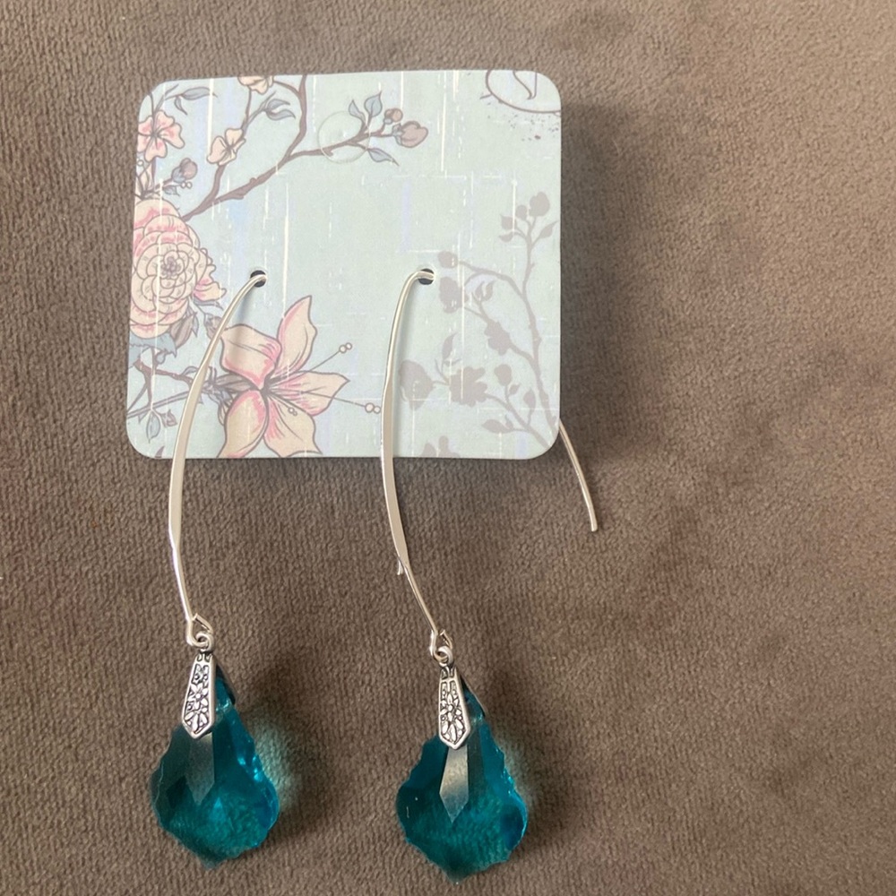 Handcrafted turquoise crystal drops on a sterling silver ear wire.